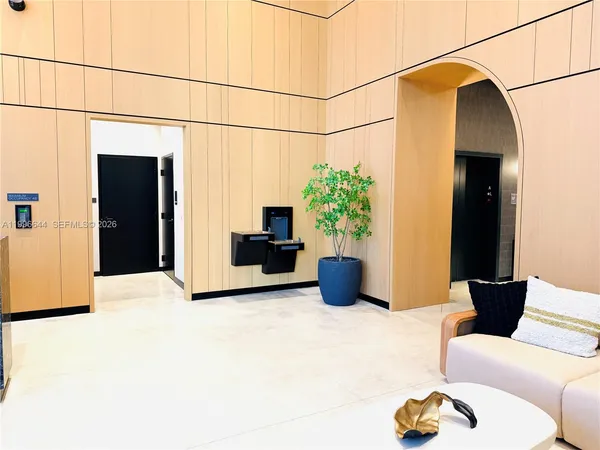 a view of hall way with furniture