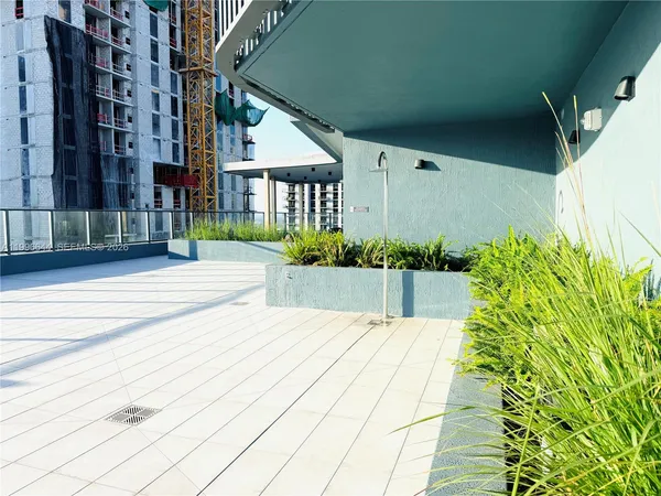 a view of a swimming pool with outdoor seating