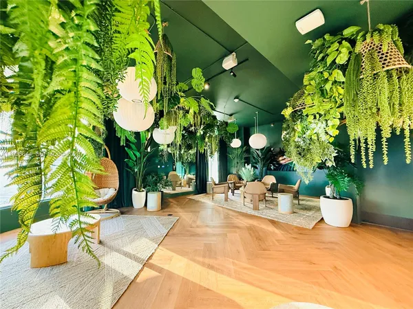 a balcony with furniture and a floor to ceiling window