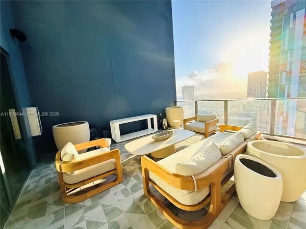 a living room with a couch and dresser