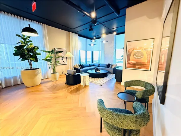 a bedroom with two beds and a dresser with swimming pool