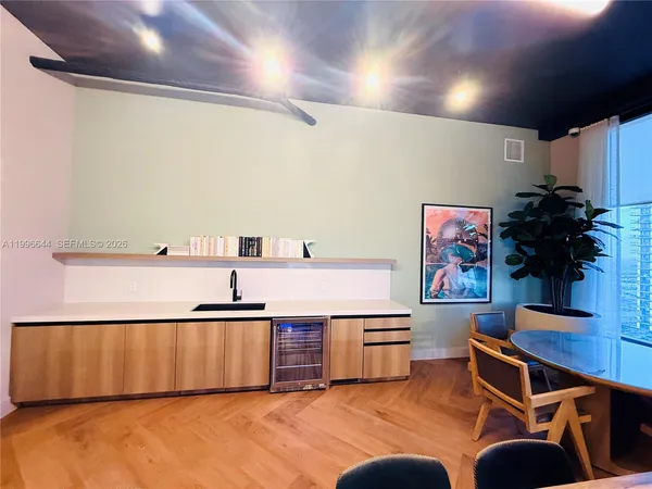 a view of a hallway with paintings on the wall