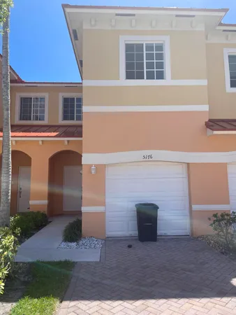 a front view of a house with yard
