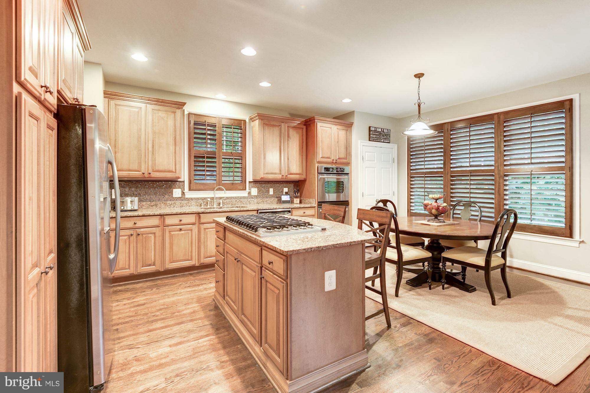 1835 Kirby Road McLean, VA 22101 - Photo 6 of 30 Kitchen with Granite Island and Gas Cooking