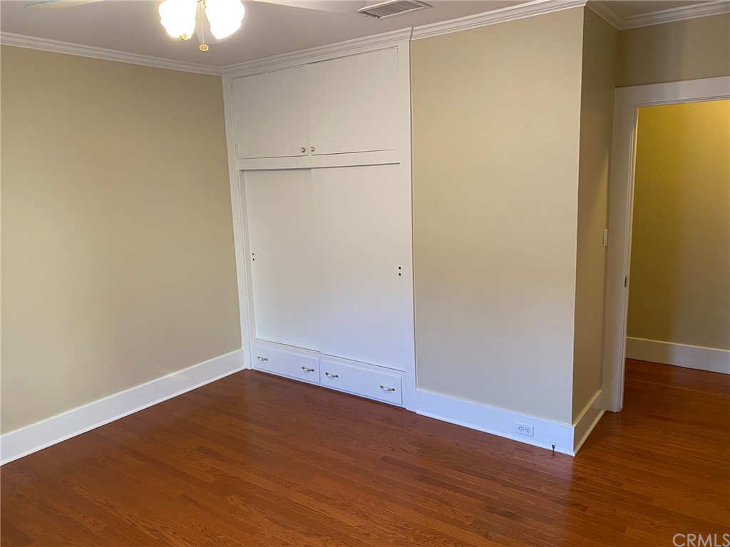 491 Eldora Road Pasadena, CA 91104 - Photo 13 of 14 an empty room with wooden floor closet and windows