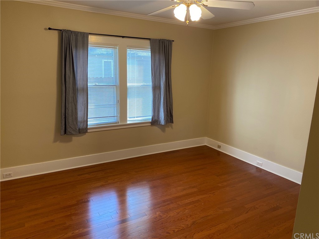 491 Eldora Road Pasadena, CA 91104 - Photo 14 of 14 an empty room with wooden floor and windows