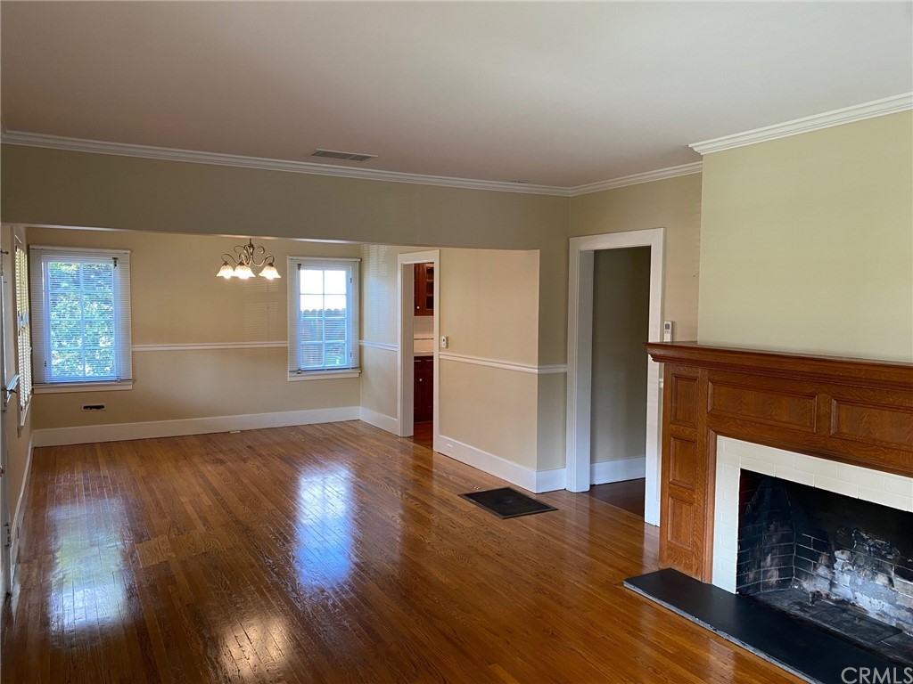 491 Eldora Road Pasadena, CA 91104 - Photo 3 of 14 a view of a livingroom with wooden floor and a fireplace