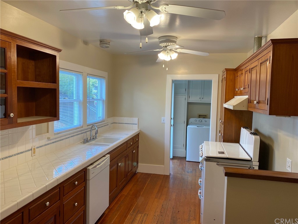 491 Eldora Road Pasadena, CA 91104 - Photo 4 of 14 a kitchen with a stove cabinets and wooden floor