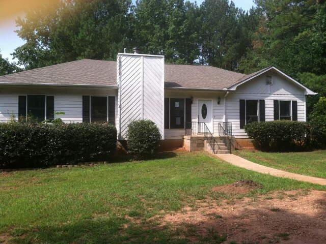240 East Mays Road Stockbridge, GA 30281 - Photo 1 of 1 a front view of a house with yard patio and green space