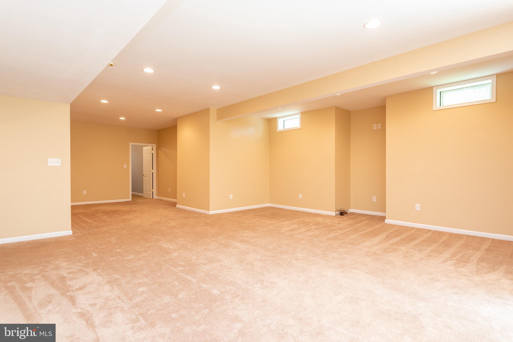 6033 Sumner Road Alexandria, VA 22310 - Photo 44 of 52 Basement with massive carpeted rec room