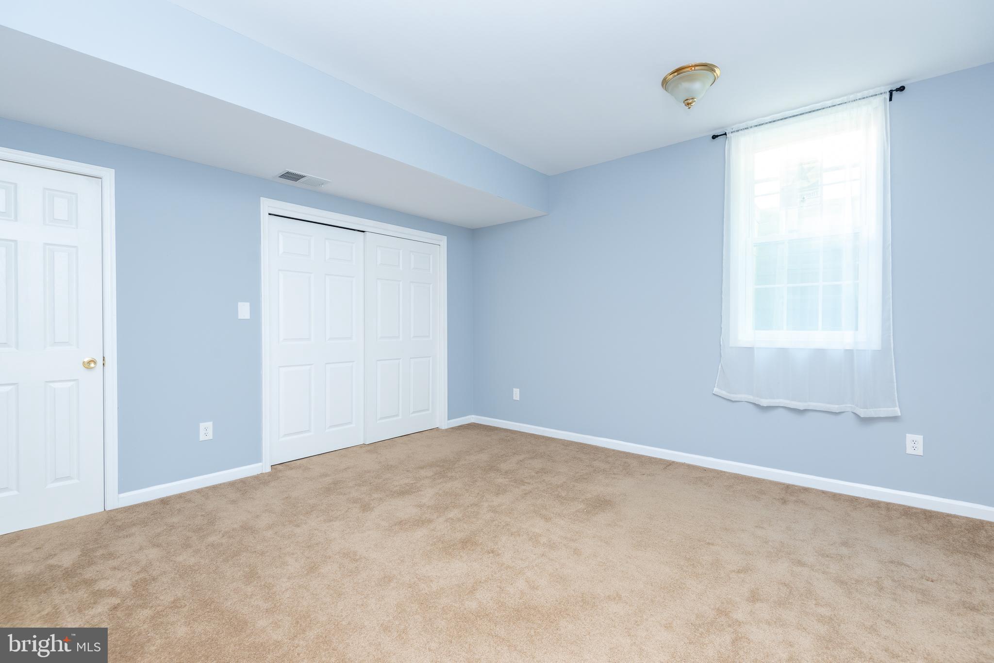 6033 Sumner Road Alexandria, VA 22310 - Photo 47 of 52 Basement bedroom with two closets and exit window
