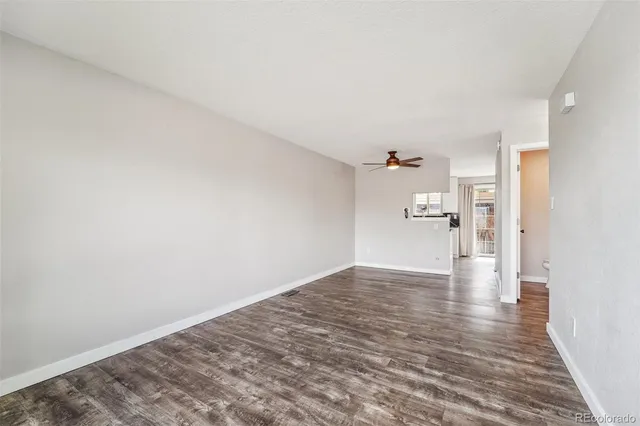 a view of a bedroom with a hardwood floor