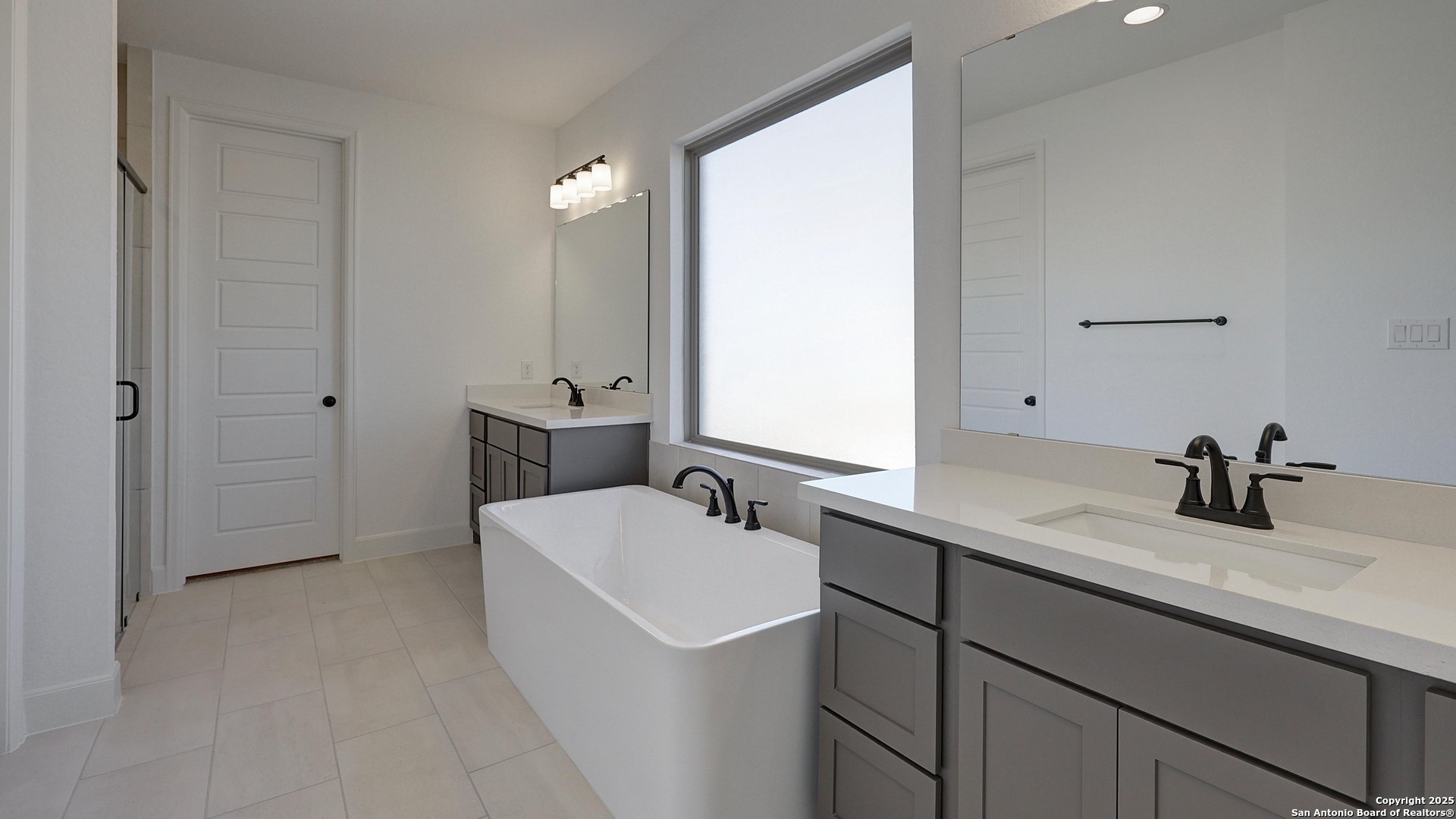 213 Hidalgo Boerne, TX 78006 - Photo 11 of 35 a bathroom with a sink and a mirror