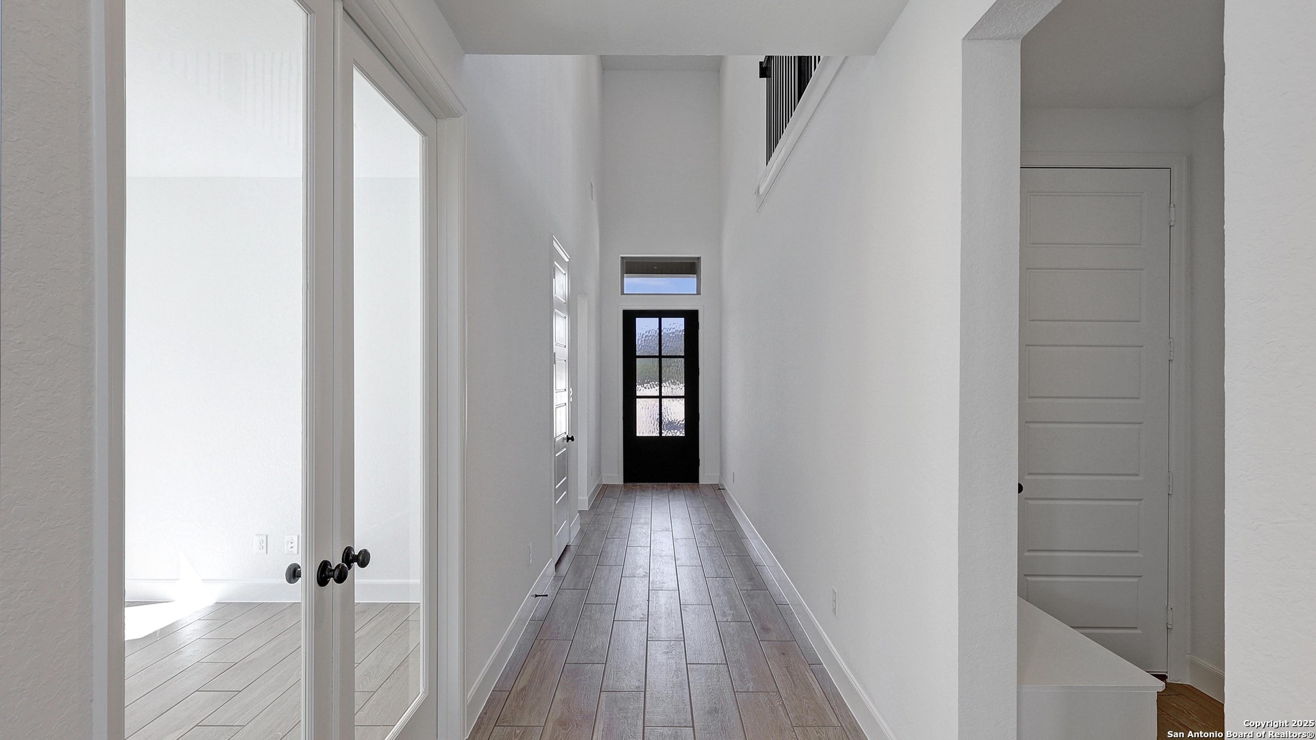 213 Hidalgo Boerne, TX 78006 - Photo 15 of 35 a view of a hallway with wooden floor and staircase
