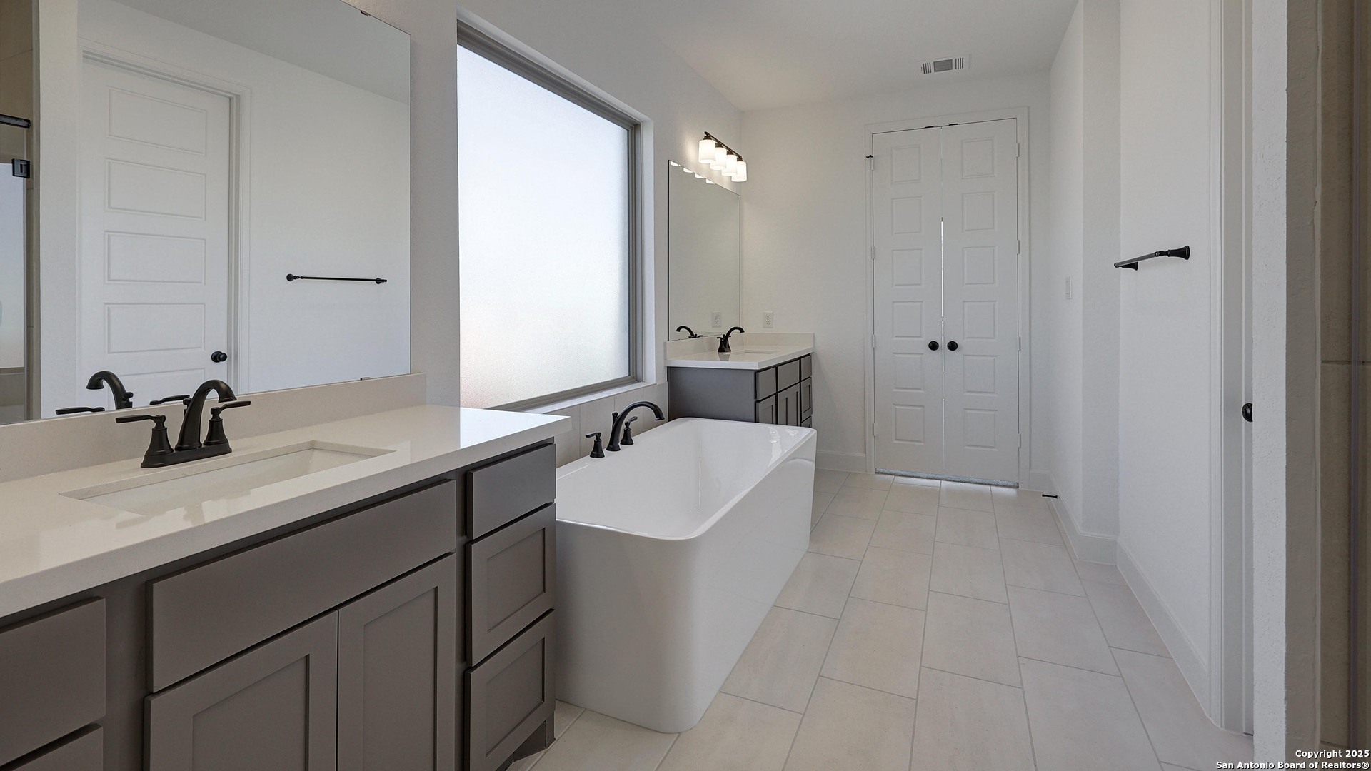 213 Hidalgo Boerne, TX 78006 - Photo 20 of 35 a bathroom with a sink double vanity and a mirror
