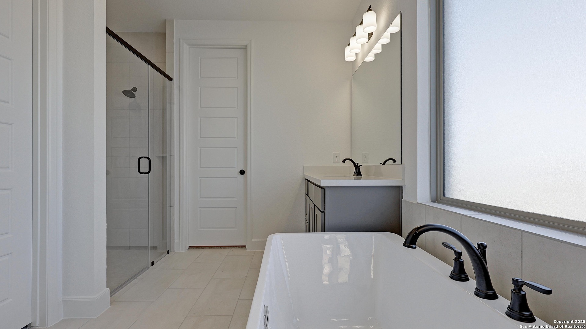 213 Hidalgo Boerne, TX 78006 - Photo 21 of 35 a bathroom with a sink and a mirror