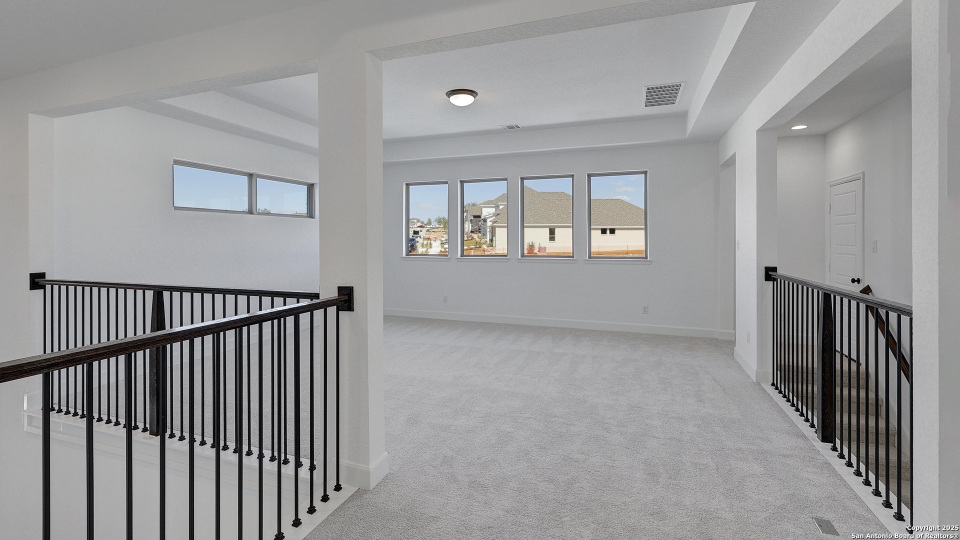 213 Hidalgo Boerne, TX 78006 - Photo 24 of 35 a view of an empty room with wooden floor and a window