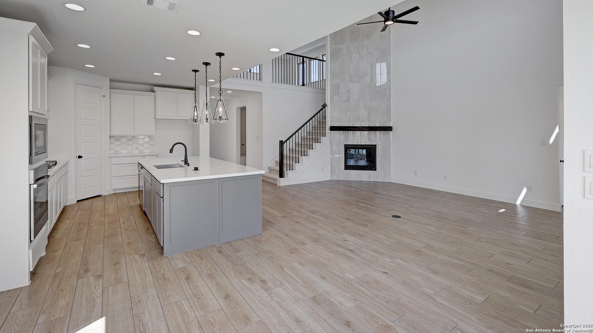 213 Hidalgo Boerne, TX 78006 - Photo 7 of 35 a view of a kitchen with wooden floor and a sink