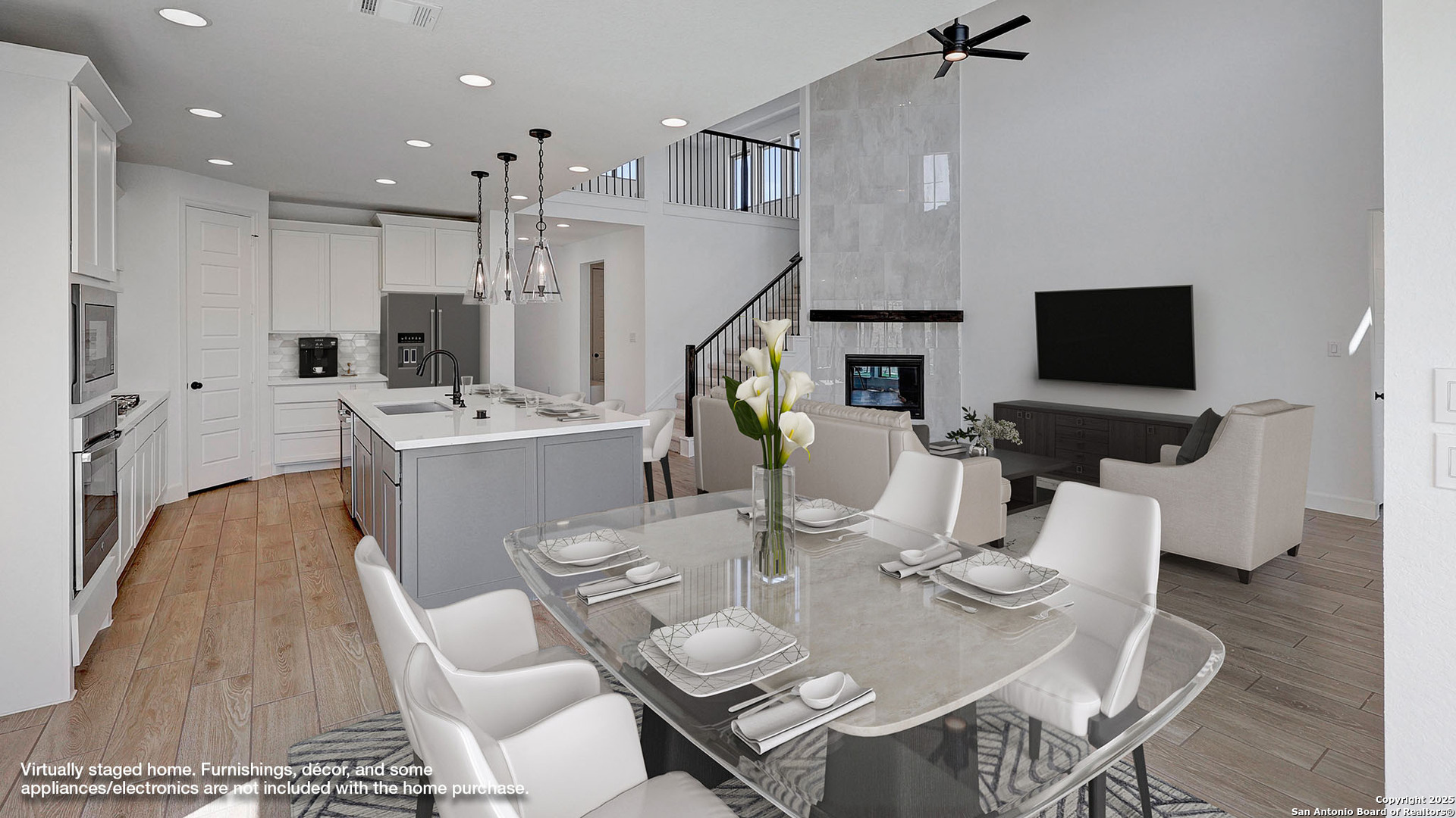 213 Hidalgo Boerne, TX 78006 - Photo 8 of 35 a living room with furniture a flat screen tv and kitchen view