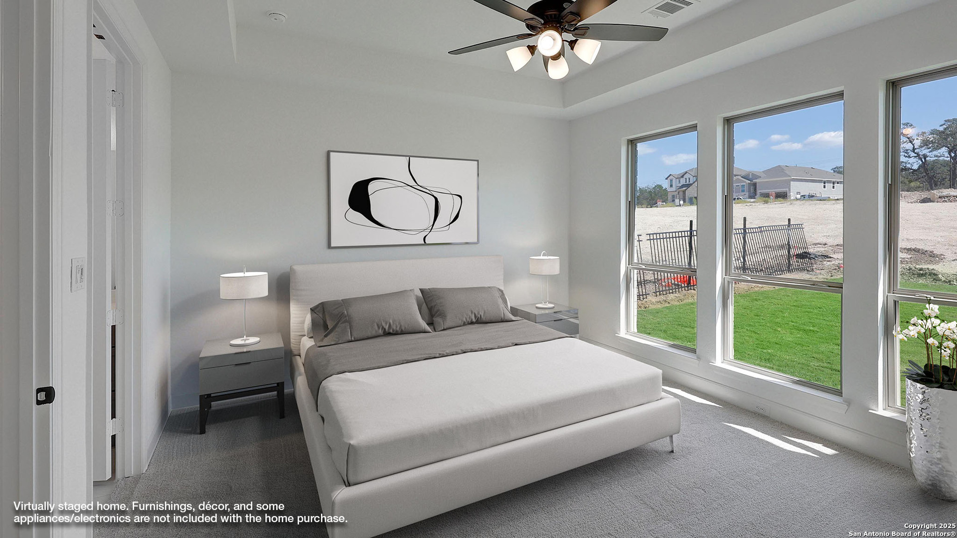 213 Hidalgo Boerne, TX 78006 - Photo 9 of 35 a bedroom with a bed and a chandelier