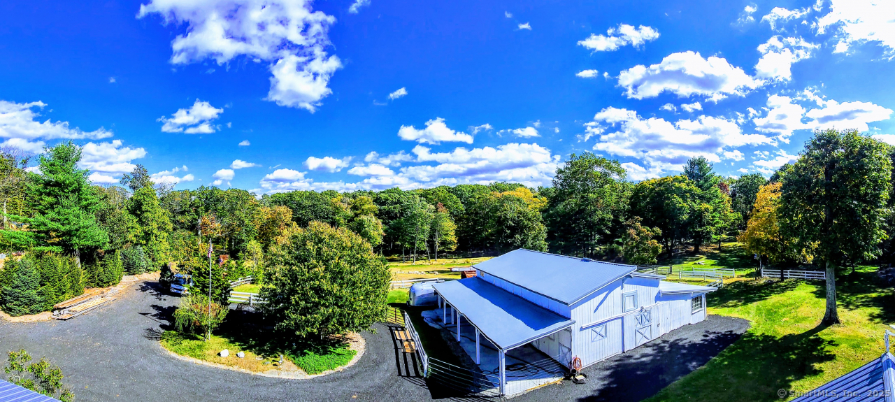 a view of a patio with table and chairs and potted plants