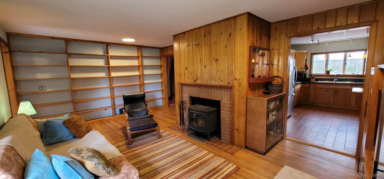 58 Botsford Hill Road Newtown, CT 06470 - Photo 27 of 39 a living room with furniture and a fireplace
