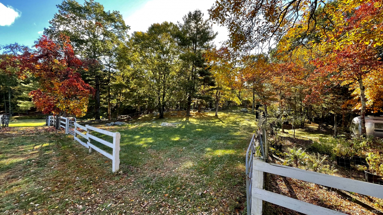 58 Botsford Hill Road Newtown, CT 06470 - Photo 36 of 39 a view of a bench in a garden