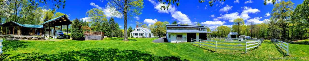 58 Botsford Hill Road Newtown, CT 06470 - Photo 39 of 39 a view of a house with a tree in a yard