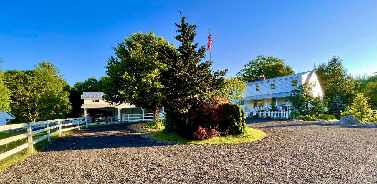 58 Botsford Hill Road Newtown, CT 06470 - Photo 5 of 39 a front view of a house with a yard