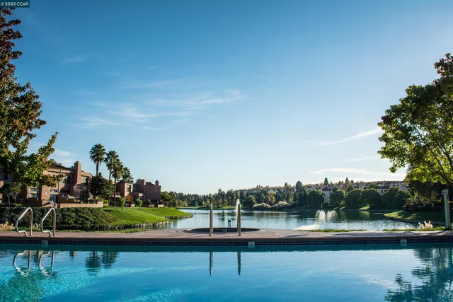 a view of a swimming pool with lounge chairs