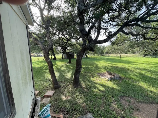 a view of outdoor space with deck and yard