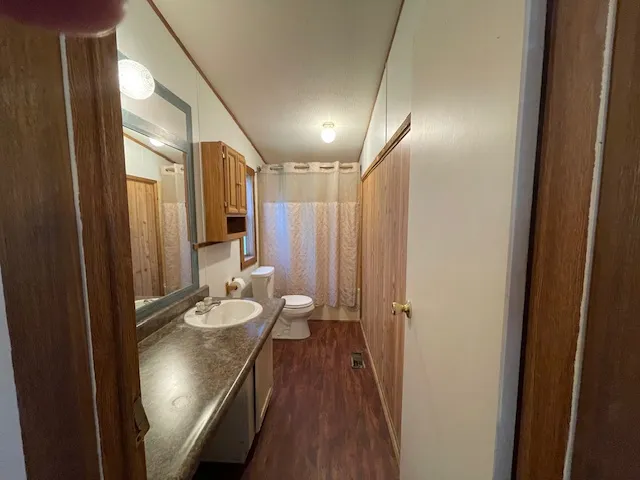 a backyard of a house with lots of green space and fountain