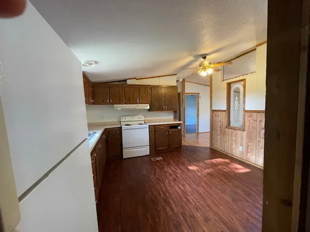 a kitchen with stainless steel appliances a sink and a refrigerator