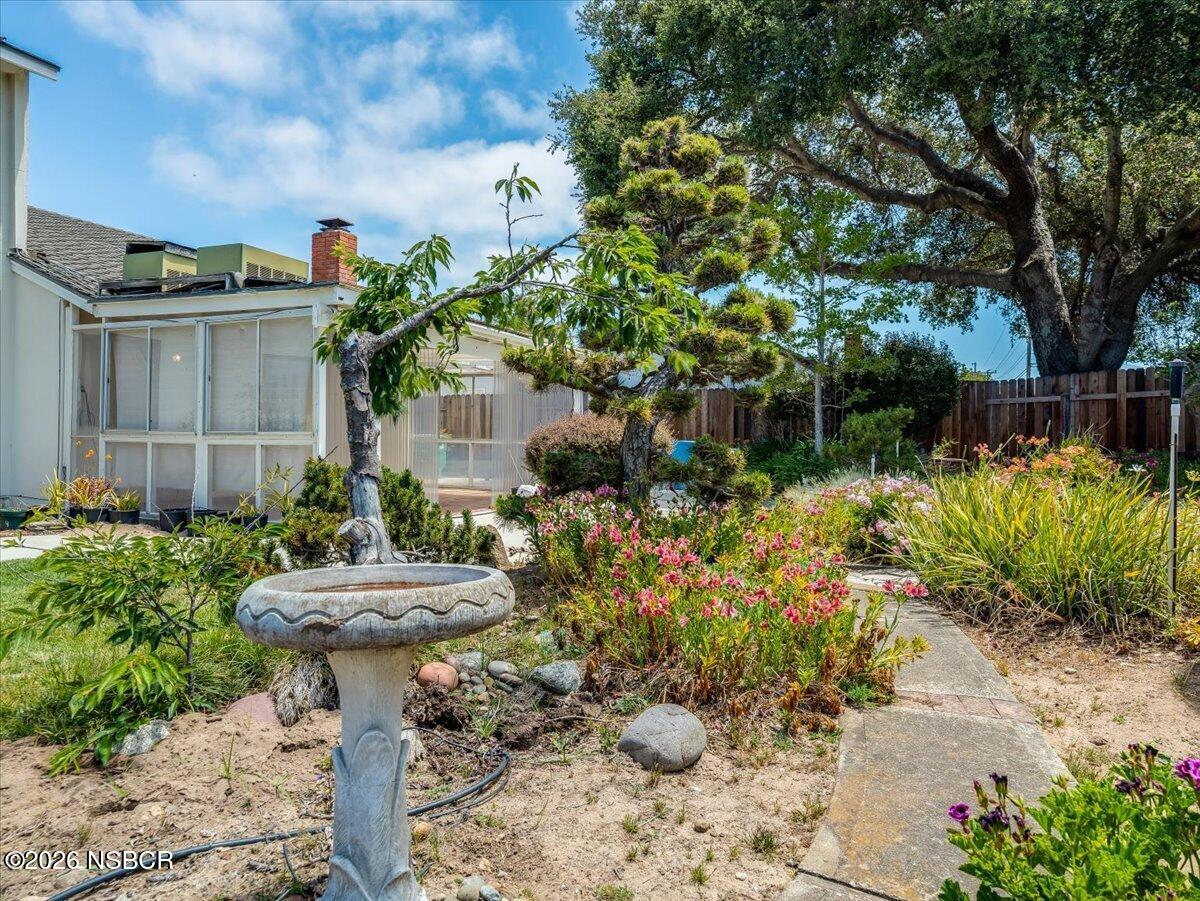 360 Tallyho Road Santa Maria, CA 93455 - Photo 57 of 72 a front view of a house with a yard and fountain