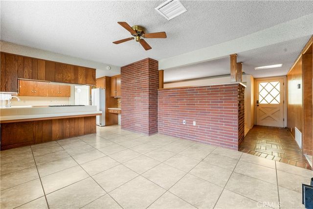 a view of a kitchen with refrigerator and garage