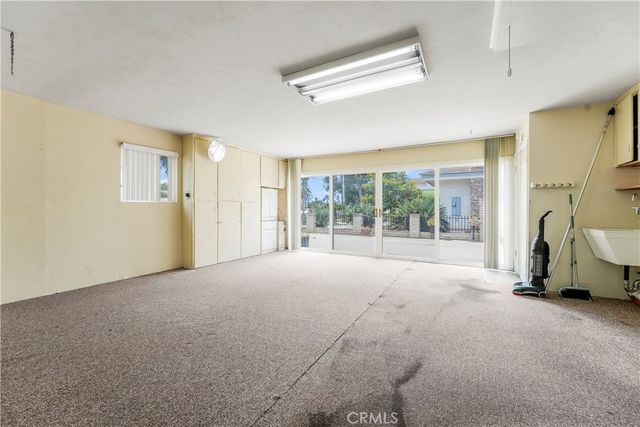 a open kitchen with cabinets a sink and stainless steel appliances