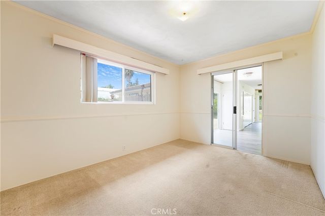 a view of empty room with windows