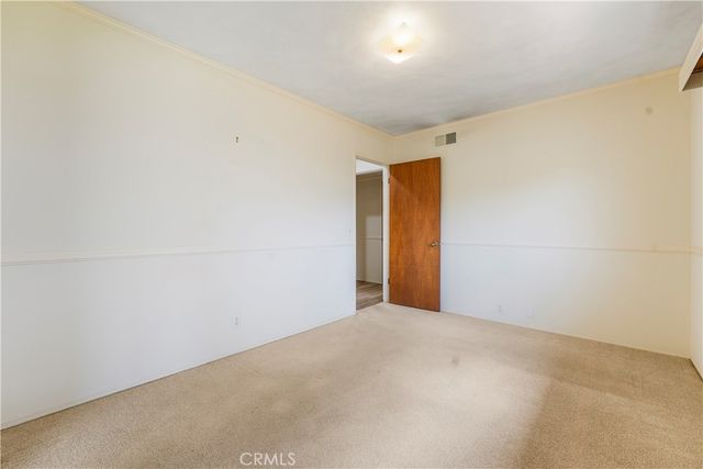 a bathroom with a sink double vanity granite tub and a mirror