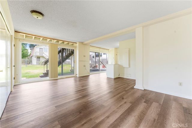 a view of a deck with wooden floor and fence