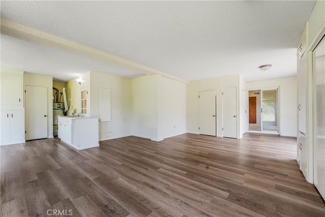 a view of a balcony with furniture and wooden floor