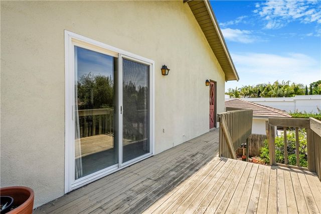 a large kitchen with cabinets and stainless steel appliances