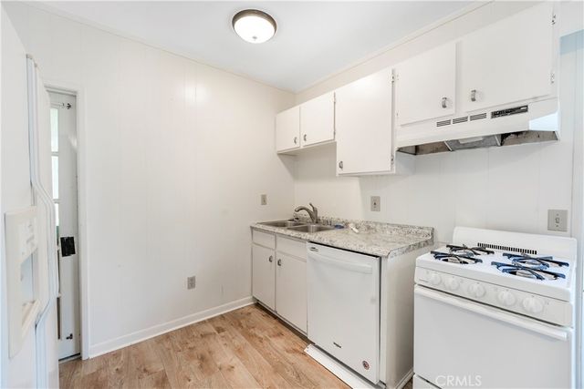 a view of an empty room with windows