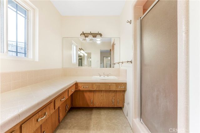 a view of balcony with wooden floor and fence