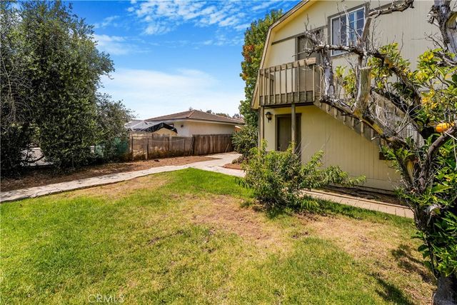 an aerial view of residential houses with city view