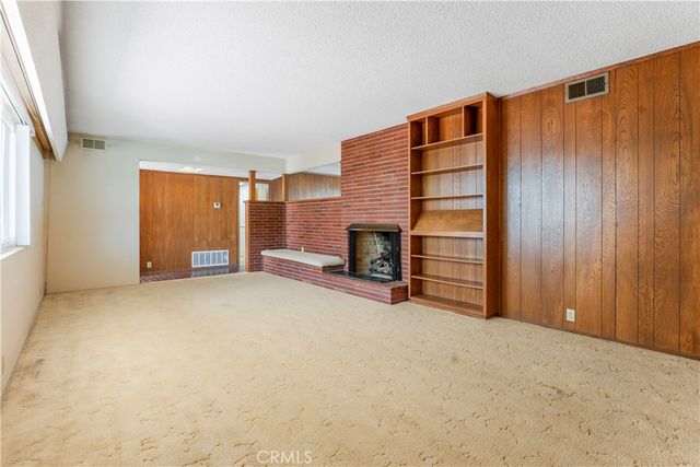 a kitchen with a sink cabinets and window