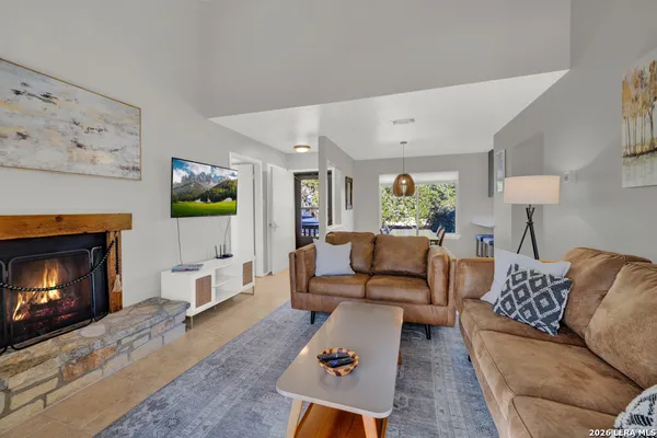 a living room with furniture and a fireplace