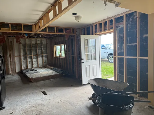 a view of porch with furniture and garden