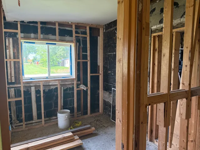 a bathroom with a glass door shower and a sink