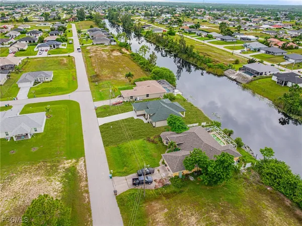 an aerial view of a house with swimming pool