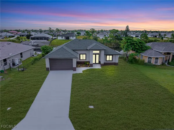 a view of a house with a big yard
